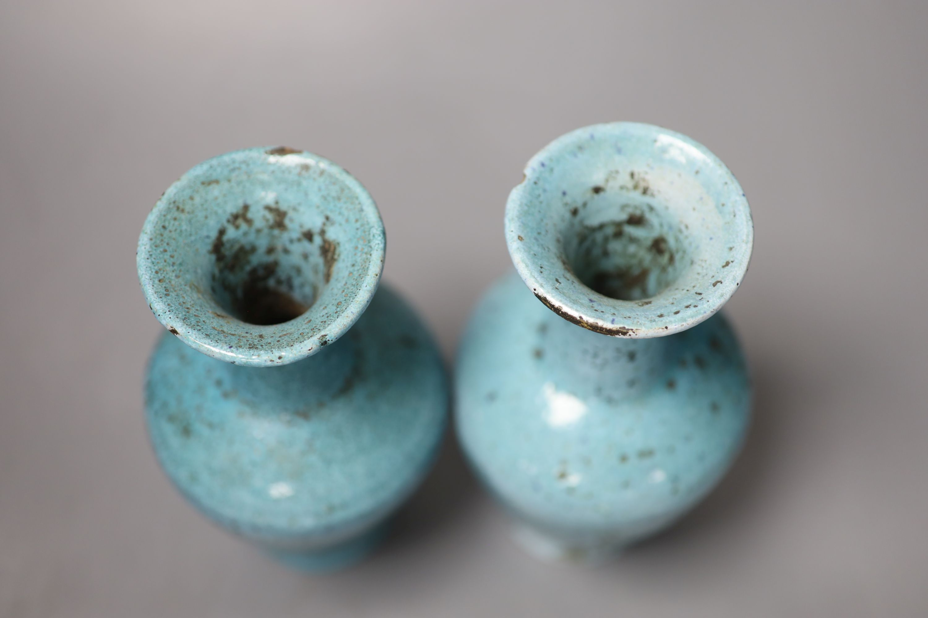 A pair of pale blue Eastern pottery vases, 16.5cm high